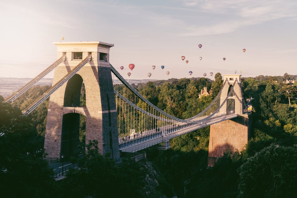 Bristol bridge with hot air balloons in the distance